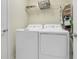 Well-equipped laundry room with modern appliances and storage for efficient laundry care at 11090 Silver Surfer Aly, Winter Garden, FL 34787