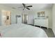 Bright main bedroom featuring wood floors, a ceiling fan, and ensuite access at 11090 Silver Surfer Aly, Winter Garden, FL 34787