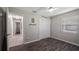 Neutral bedroom featuring updated floors and a double window for natural light at 11136 Bronson Rd, Clermont, FL 34711