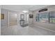 Inviting foyer featuring tile floors, a decorative table, and views into other rooms at 11136 Bronson Rd, Clermont, FL 34711