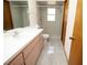 Bright bathroom featuring a single sink vanity, and walk-in shower at 11740 E Highway 25, Ocklawaha, FL 32179