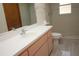 Bathroom featuring a large sink, faucet, and mirror with a walk-in shower at 11740 E Highway 25, Ocklawaha, FL 32179