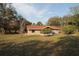 Exterior of home showing the yard with grass and some trees at 11740 E Highway 25, Ocklawaha, FL 32179