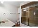 Bathroom featuring a vanity with a vessel sink, toilet, and shower/tub with sliding doors at 12320 Blue Heron Way, Leesburg, FL 34788