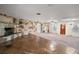 Spacious living room featuring a unique stone wall and fireplace, and neutral colored carpet at 12320 Blue Heron Way, Leesburg, FL 34788