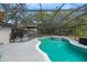 The screened-in pool features a spa and is surrounded by ample patio space, perfect for outdoor enjoyment at 1236 Selman Rd, Leesburg, FL 34748