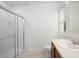 Bathroom featuring a glass shower, neutral tile flooring, and a single sink vanity at 125 Sunny Day Way, Davenport, FL 33897