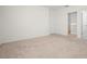 Neutral carpeted bedroom with an entry to a walk in closet at 125 Sunny Day Way, Davenport, FL 33897