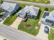 Aerial view of a home with mature landscaping, a two-car garage, and solar panels at 1256 Camero Dr, Lady Lake, FL 32159