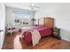 Bedroom featuring wood floors, a ceiling fan, natural light, and a calm atmosphere at 1256 Camero Dr, Lady Lake, FL 32159