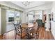 Inviting dining room with an archway, columns and access to a patio at 1256 Camero Dr, The Villages, FL 32159