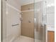 Close up of the shower area, equipped with grab bars and seating for safety and convenience at 1256 Camero Dr, The Villages, FL 32159