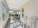 Enclosed sunroom with plenty of natural light featuring table, chairs and bar stools at 1256 Camero Dr, The Villages, FL 32159