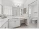 Bright bathroom featuring vanity with marble counters and adjacent toilet room at 164 Palermo Pl, The Villages, FL 32159