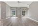 Bright living room with hardwood floors and a view of the backyard at 17408 Tailfeather Ct, Clermont, FL 34711