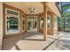 Covered patio with ceiling fan and view of the screen enclosed pool at 17408 Tailfeather Ct, Clermont, FL 34711