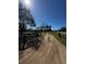 Image of tire tracks along the driveway that lead up to the ranch-style house at 18316 Keene Rd, Altoona, FL 32702