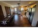 Full kitchen view with wooden cabinets, stainless steel appliances, and a dining table at 18316 Keene Rd, Altoona, FL 32702