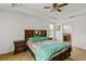 This bedroom offers a ceiling fan, carpet flooring, and a cozy atmosphere at 1841 Dunn Cove Dr, Apopka, FL 32703