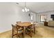 Bright dining room with tile flooring and views to the living room at 1841 Dunn Cove Dr, Apopka, FL 32703