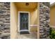 Front door featuring stone columns and neutral paint at 1841 Dunn Cove Dr, Apopka, FL 32703