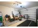 Spacious garage with abundant storage and a ceiling fan offers ample space for vehicles and projects at 1841 Dunn Cove Dr, Apopka, FL 32703