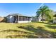 This backyard features a shed and a screened-in porch at 1917 Emily Blvd, Winter Haven, FL 33884