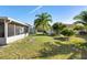 Large backyard featuring a storage shed and a screened-in porch at 1917 Emily Blvd, Winter Haven, FL 33884