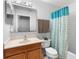 Bathroom featuring a wood vanity and sink and a blue shower curtain at 1917 Emily Blvd, Winter Haven, FL 33884