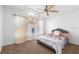 Bright bedroom featuring a ceiling fan, natural light, and curtains at 1917 Emily Blvd, Winter Haven, FL 33884