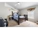 Spacious bedroom featuring a ceiling fan, vaulted ceiling and elegant dark wood furniture at 1917 Emily Blvd, Winter Haven, FL 33884