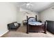 Neutral bedroom featuring a ceiling fan, vaulted ceiling and elegant dark wood furniture at 1917 Emily Blvd, Winter Haven, FL 33884