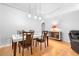 Bright dining area showcases a modern table with seating for four and wood floors at 1917 Emily Blvd, Winter Haven, FL 33884