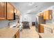 Cozy kitchen featuring wooden cabinets, stainless steel refrigerator, and white appliances at 1917 Emily Blvd, Winter Haven, FL 33884