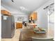 Open kitchen and dining area featuring stainless steel appliances and tile flooring at 1917 Emily Blvd, Winter Haven, FL 33884