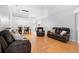 Open living area with dining and seating features wood flooring and arched doorways, creating a seamless flow at 1917 Emily Blvd, Winter Haven, FL 33884