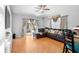 Bright living room featuring a comfortable sofa, sliding glass door to outdoor living, and wood-look floors at 1917 Emily Blvd, Winter Haven, FL 33884