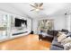 Bright living room with custom stone accent wall, large TV, and comfortable seating, perfect for relaxation at 1917 Emily Blvd, Winter Haven, FL 33884