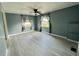 This bedroom features new floors, updated lighting, and neutral colored walls at 206 Aspen Cir, Leesburg, FL 34748