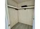 Walk-in closet with neutral walls, laminate flooring, and shelving for storage at 206 Aspen Cir, Leesburg, FL 34748