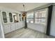 The dining area includes built-in cabinets, lots of light from windows, and new floors at 206 Aspen Cir, Leesburg, FL 34748