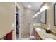 Bathroom features a glass enclosed shower and double vanity at 2165 Smoaks St, The Villages, FL 32162