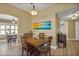 Dining room features modern light fixture and a large painting at 2165 Smoaks St, The Villages, FL 32162