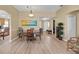 Dining room featuring ceiling fan, light fixture, and access to kitchen at 2165 Smoaks St, The Villages, FL 32162