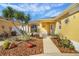 Home's front yard featuring desert landscaping, decorative rocks and native plants at 2165 Smoaks St, The Villages, FL 32162