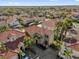 Stunning aerial view showcasing the home's landscaping and tile roof in this lovely community at 231 Brunello Dr, Davenport, FL 33897