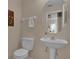 Powder room featuring a pedestal sink, a toilet and neutral paint at 231 Brunello Dr, Davenport, FL 33897