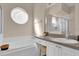 Bathroom featuring a garden tub, glass enclosed shower, and a single sink vanity at 231 Brunello Dr, Davenport, FL 33897