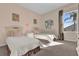 Bright bedroom with twin beds, a neutral color scheme, and plenty of natural light from a window at 231 Brunello Dr, Davenport, FL 33897