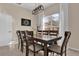 Bright dining room features tile floors, modern light fixture, and seats eight at 231 Brunello Dr, Davenport, FL 33897